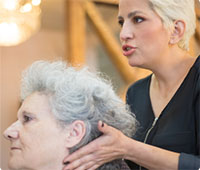A woman receives a hair treatment at Melody Salon, showcasing professional hairstyling services in a welcoming environment.